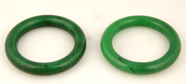 A near pair of dark green jade