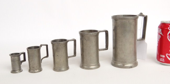 Assembled set five pewter measures.