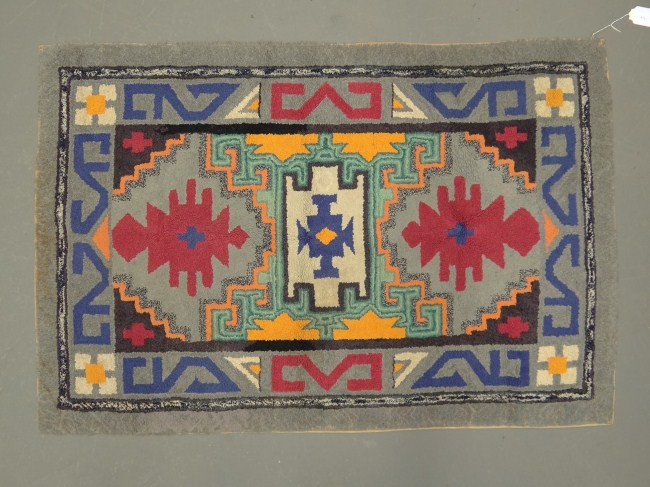 C. 1920's geometric hooked rug.