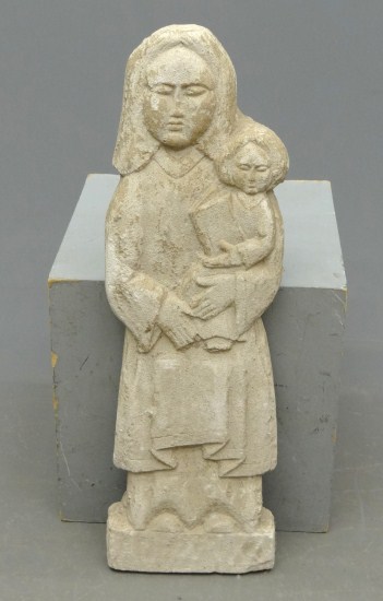 Cement mother and child figure.