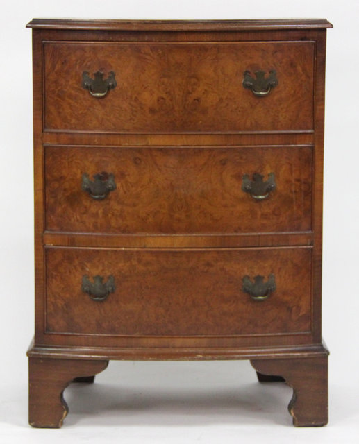 A mahogany bowfront chest of three