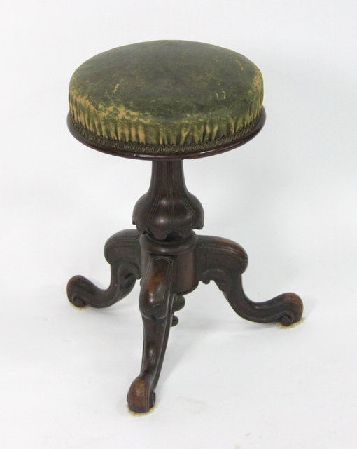 A Victorian adjustable piano stool with