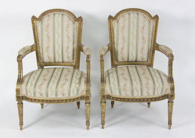 A pair of Louis XVI style giltwood