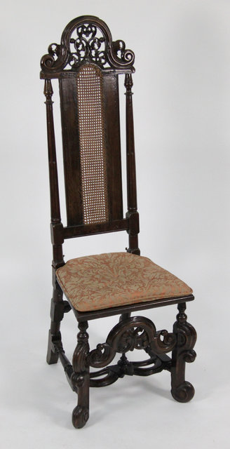 A walnut high back chair of Carolean