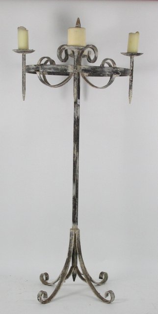 A wrought iron four-light candle