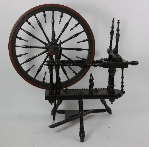 A 19th Century turned cherry wood spinning