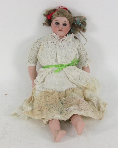 An Armand Marsielle bisque head doll