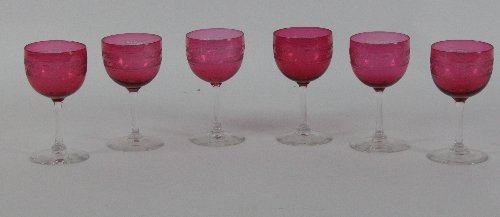 Six ruby tinted glasses with clear stems