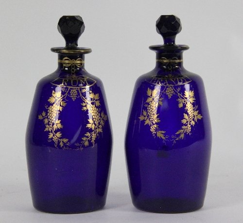 A pair of blue glass spirit decanters
