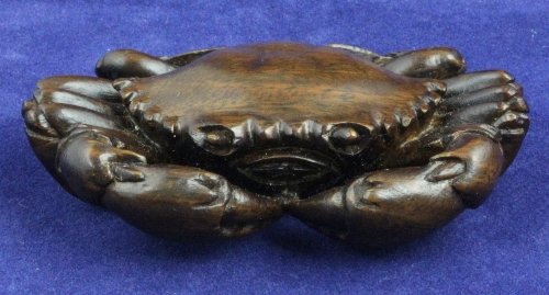 A wooden netsuke signed in red