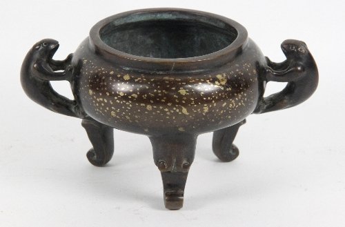 A Chinese bronze censer with gold