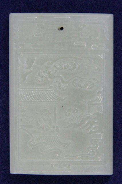A jade tablet carved with a landscape