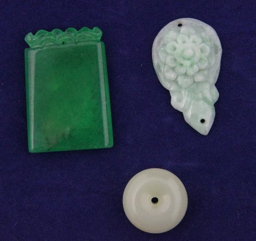 A jade button and two jade pendants