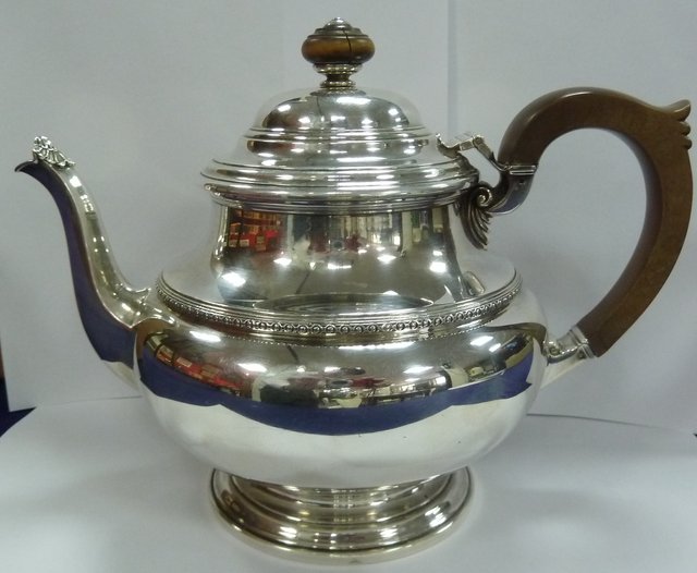 A circular silver teapot D S Ltd 1689d9