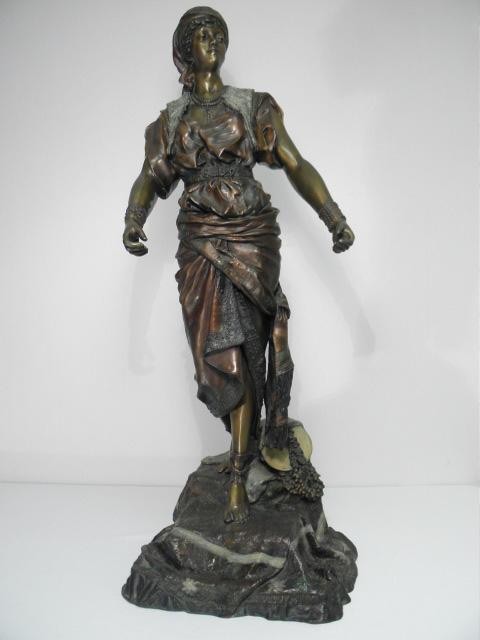 Large bronze sculpture depicting a gypsy