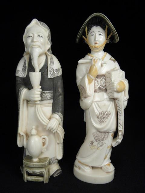 Pair of Japanese carved ivory figures.