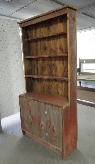 Primitive barnwood cupboard in red paint.