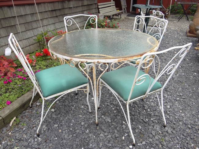 Wrought iron glass top patio table with