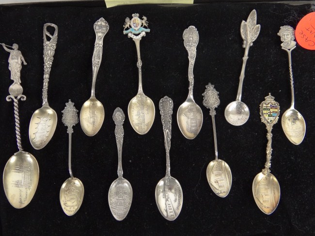 Lot 12 various sterling souvenir spoons.