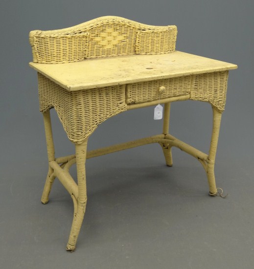 Early wicker table in yellow paint.