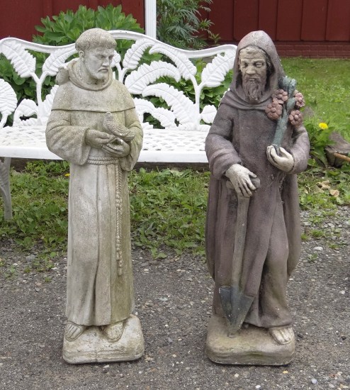 Lot two cement statues.