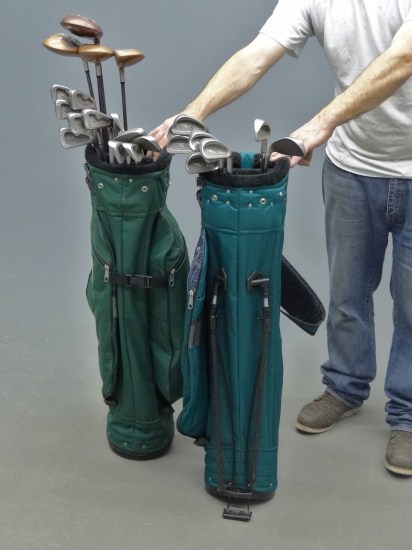 Misc. golf clubs and two bags.