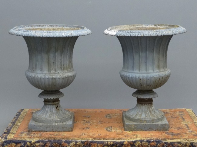 Pair 19th c. cast iron urns. 28