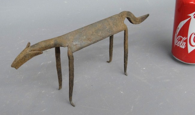 Folk art metal dog sculpture. 9 Length.