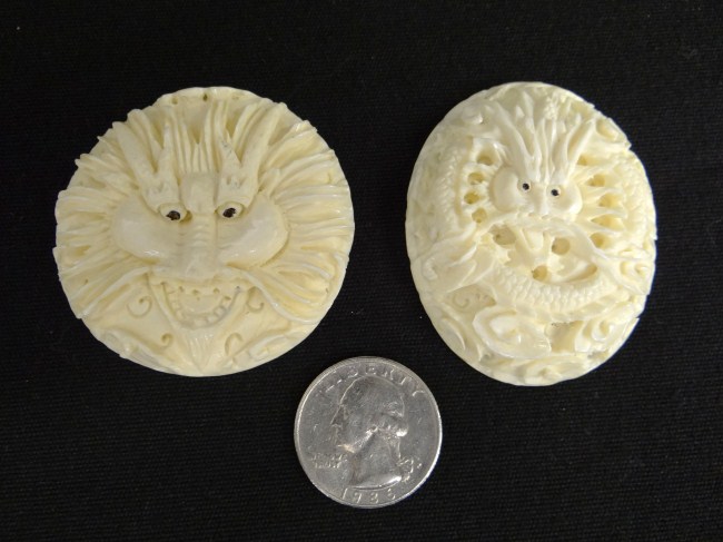 Pair Asian carved ivory pendants.