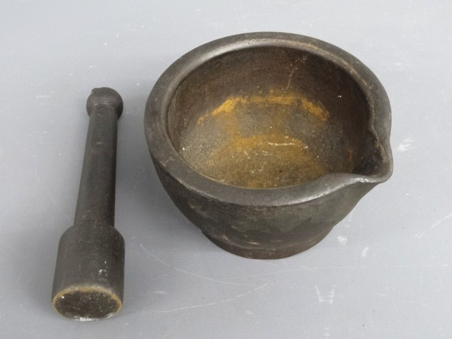 19th c. iron mortar and pestle.