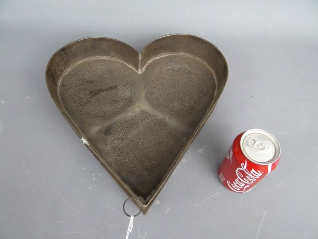 Heart shaped metal strainer.