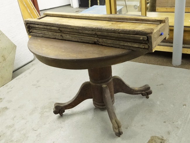 19th c. round oak table with leaves.