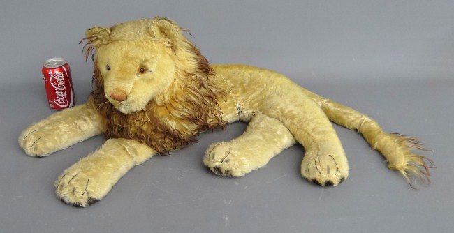 Steiff (?) stuffed reclining lion.