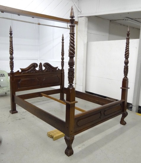 Contemporary carved four poster bed.