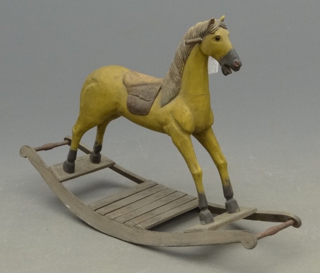Carved and painted rocking horse.