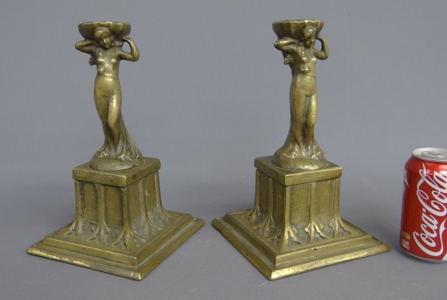 Pair brass figural women candlesticks.