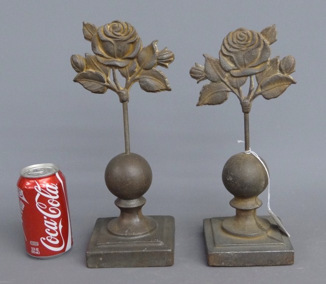 Pair cast iron flower decorations.