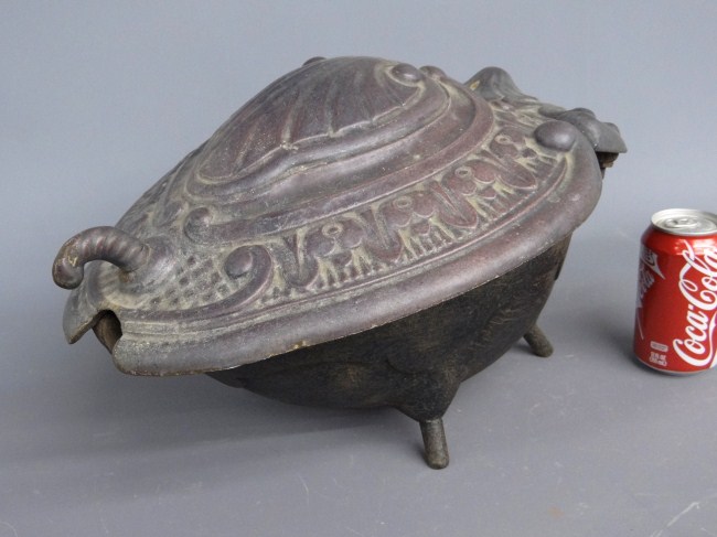 19th c. cast iron coal scuttle.