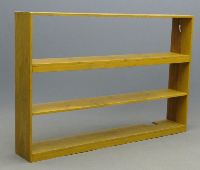 C. 1900 pine shelf in mustard paint.