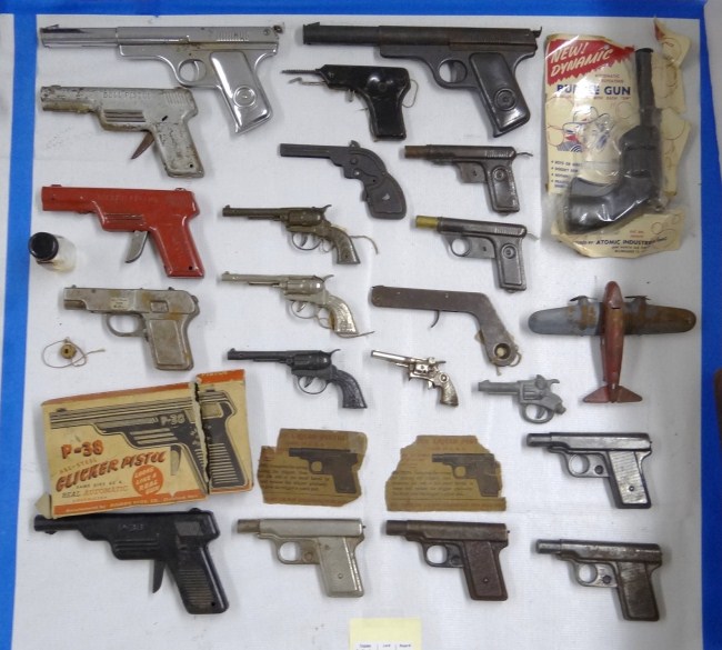Collection of various vintage toy guns.
