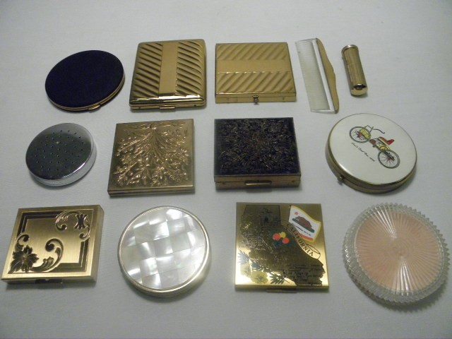 Assorted vintage powder compacts.