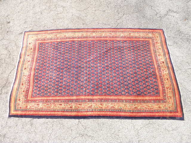 Oriental style wool pile rug. Red