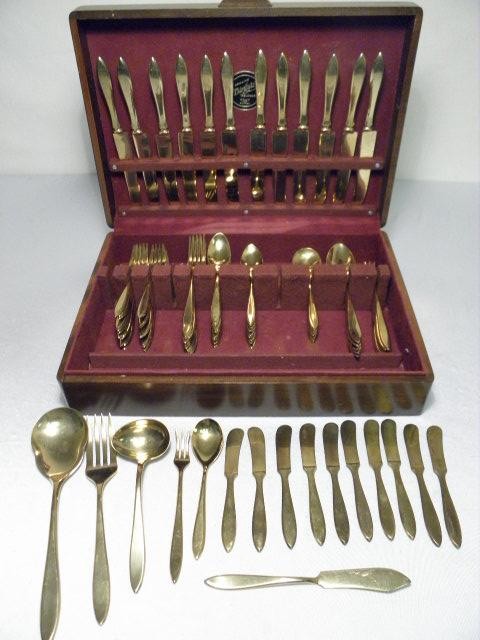 Dirilyte gold toned flatware group.