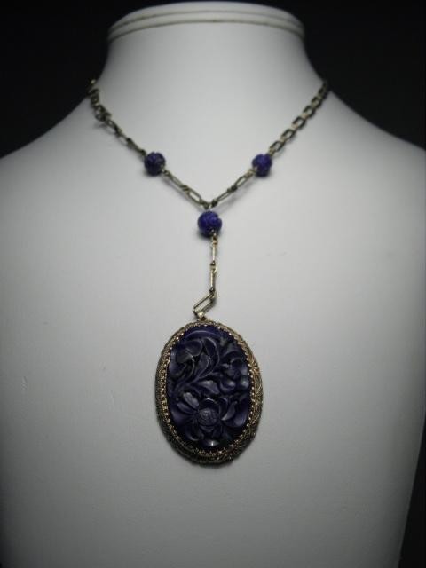 A necklace consisting of a carved