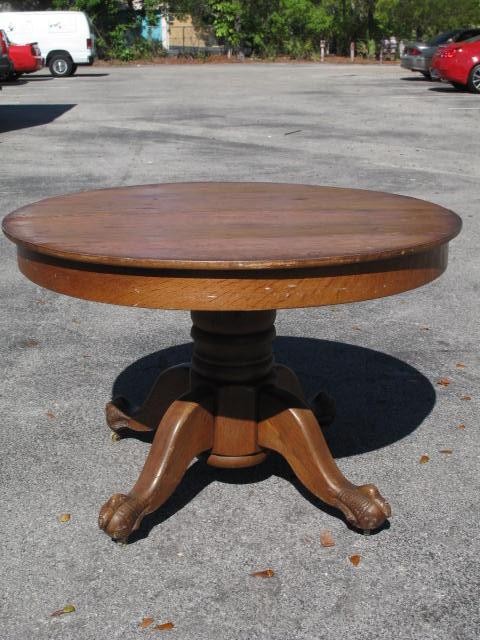 44 round oak pedestal table with claw