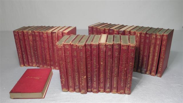 Set of 40 red leather bound books.