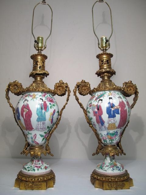 A pair of Rose Famille vases mounted