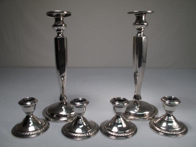 Six Sterling silver weighted candlesticks.