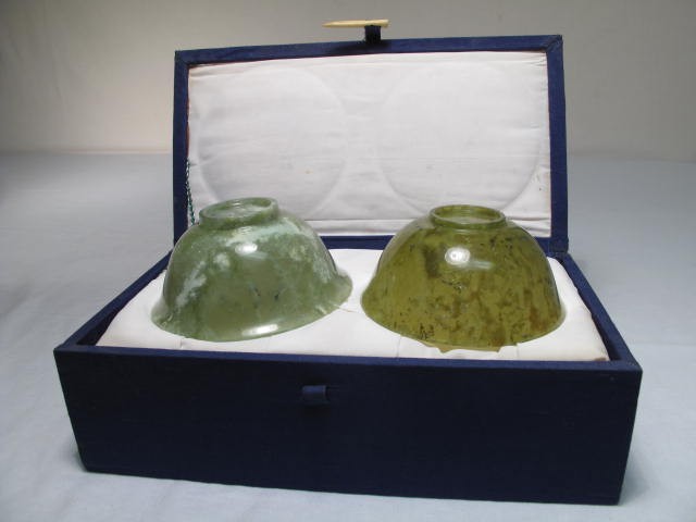 Two carved Jade bowls in a decorative