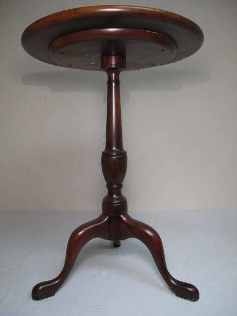 Mahogany circular table on tripod pedestal.